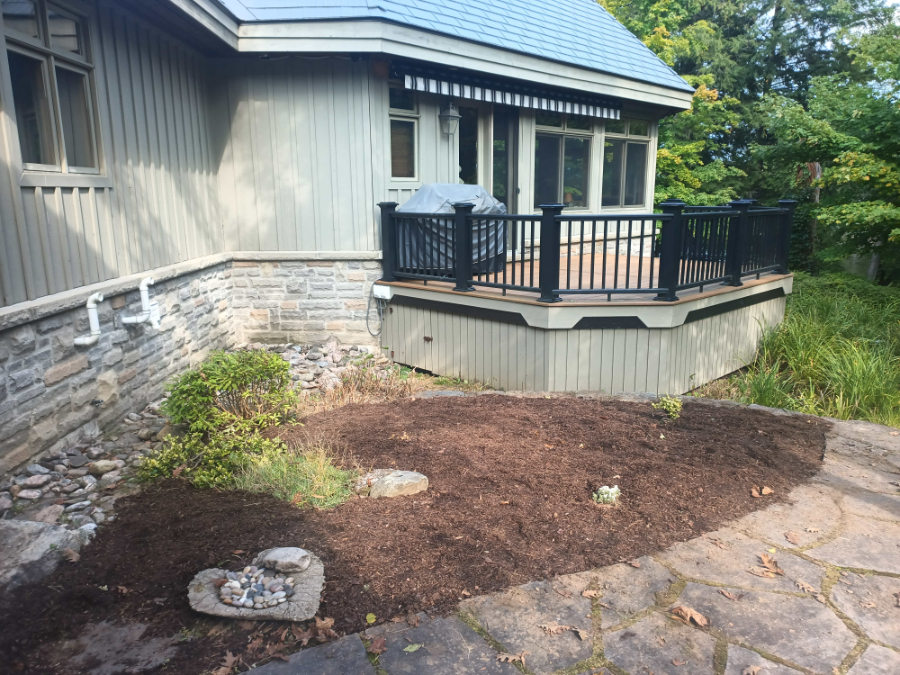 The sunny bed at the cottage ready to be planted after a thin layer of mulch was added.