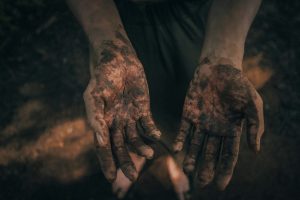 dirty hands covered in soil